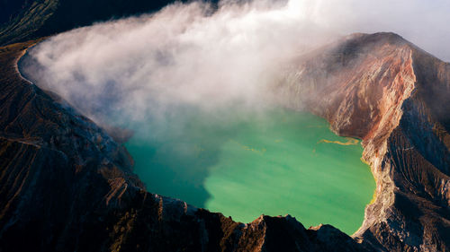 Smoke emitting from volcanic mountain