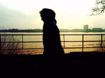 Silhouette of people at sunset