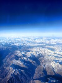 Scenic view of snow covered mountains against sky