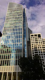 Low angle view of office building against sky