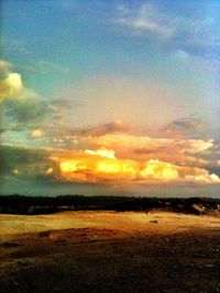 Scenic view of landscape against cloudy sky