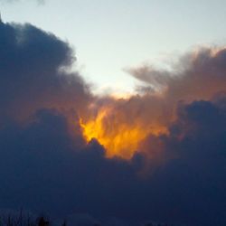 Low angle view of cloudy sky during sunset