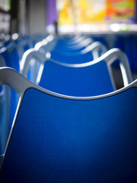 Close-up of empty blue seats in bus