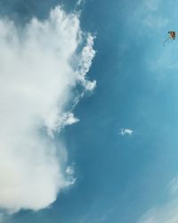 Low angle view of kite flying against sky