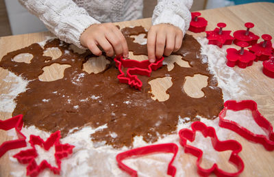 Low section of woman holding gift