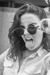 Close-up portrait of woman with sunglasses