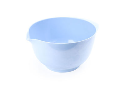 Close-up of empty coffee cup against white background