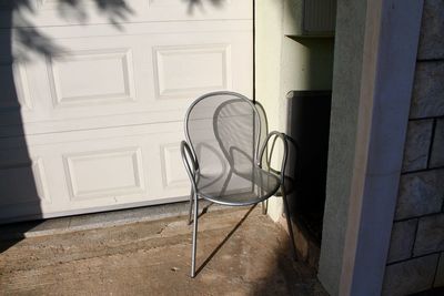 Empty chair outside building