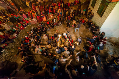 High angle view of people on street at night