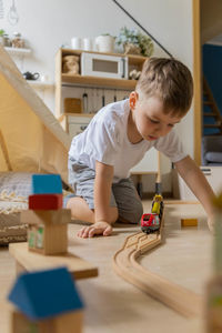 Boy playing with toy blocks