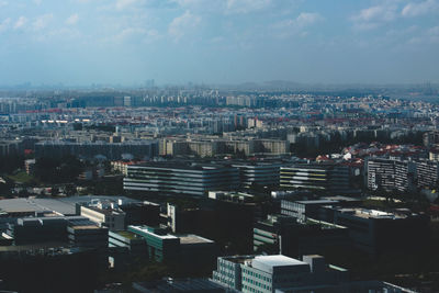 High angle view of buildings in city against sky