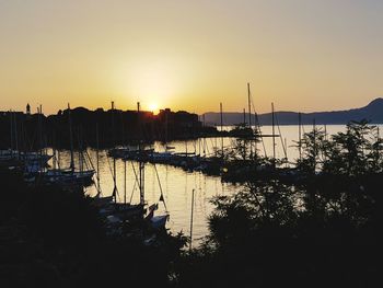 Silhouette of marina at sunset
