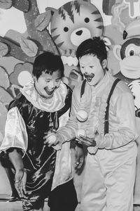 Full length of happy boy wearing mask