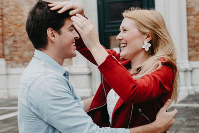 Smiling couple standing in city