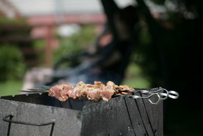 Close-up of meat on barbecue grill