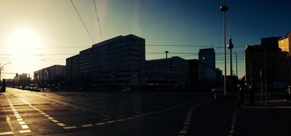 View of city street at sunset