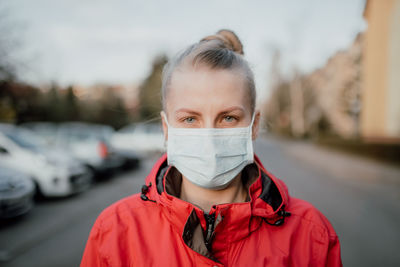 Portrait of woman wearing mask in winter