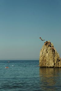 Scenic view of sea against blue sky