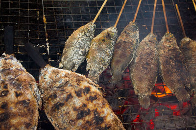 Close-up of meat on barbecue grill