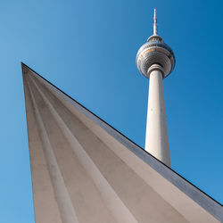 Low angle view of building against clear blue sky