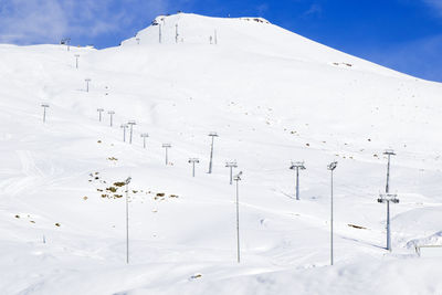 Georgian ski resort in gudauri. snowy mountains, daytime and sunlight.