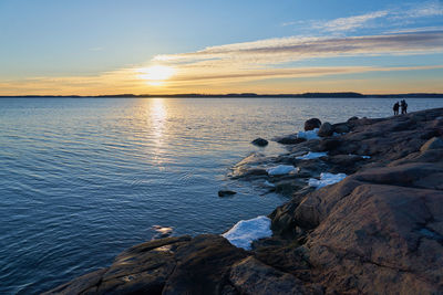 Scenic view of sea against sky during sunset