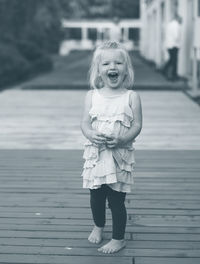 Portrait of cute girl standing outdoors