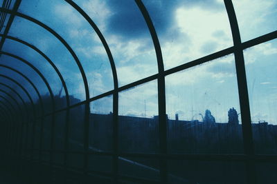 Low angle view of built structure against cloudy sky