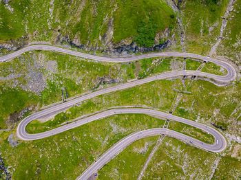 High angle view of winding road amidst trees