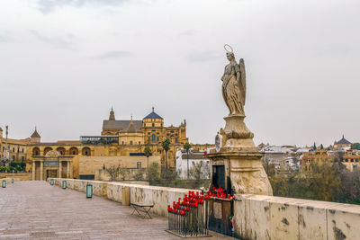 Statue of historic building against sky