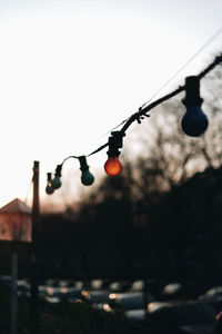 Close-up of light bulb against sky