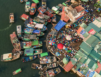 High angle view of fishing boats and market