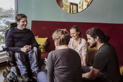 Smiling coworkers talking together