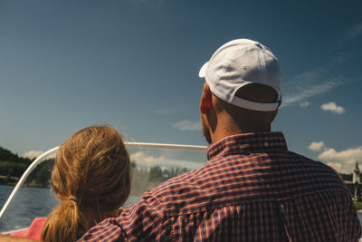 Rear view of people looking at sky