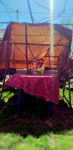 Chairs and table in field