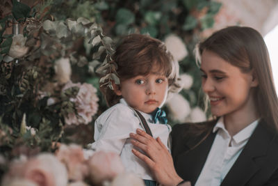 Portrait of mother and daughter outdoors