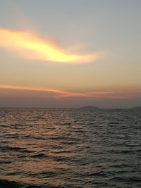 Scenic view of sea against sky at sunset