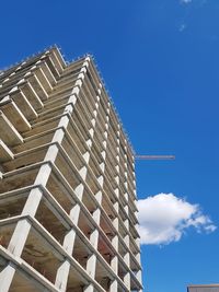 Low angle view of building against blue sky