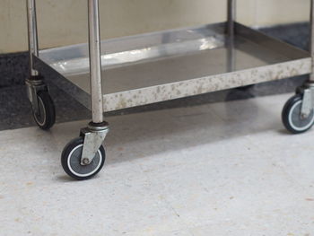 Cropped image of cart on floor