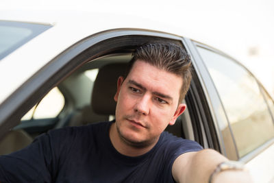 Portrait of man in car