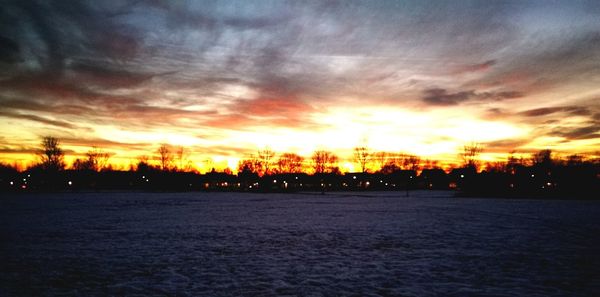 Scenic view of dramatic sky during sunset