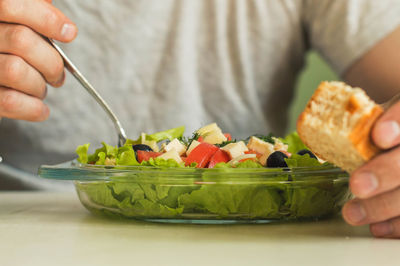 Close-up of man eating food