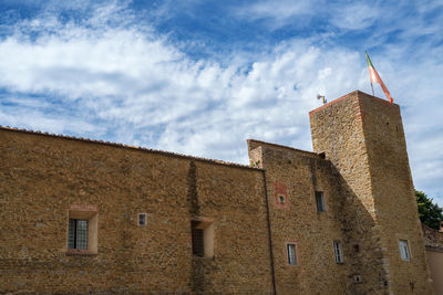 Low angle view of old building against sky