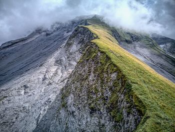 Aerial view of clouds over mountain