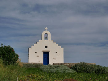 Church on field against sky