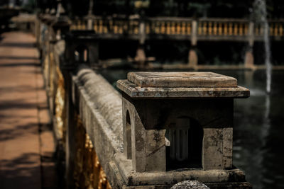 Close-up of old temple against building