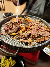 High angle view of meat in container on table