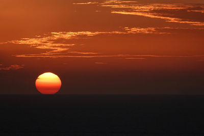 Scenic view of sea against romantic sky at sunset