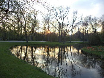 Scenic view of lake against sky during sunset