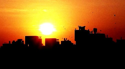 Silhouette of buildings at sunset